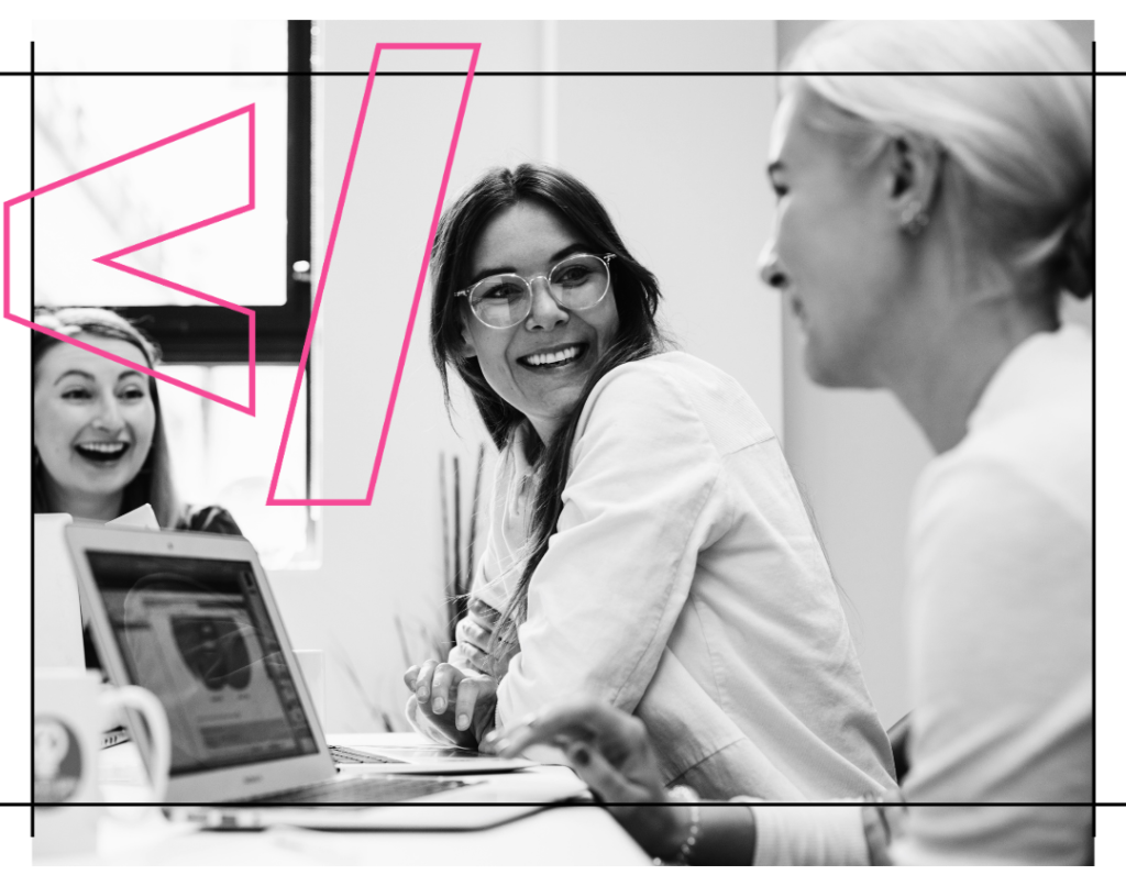 Three women laughing while learning to code with pink icon overlay